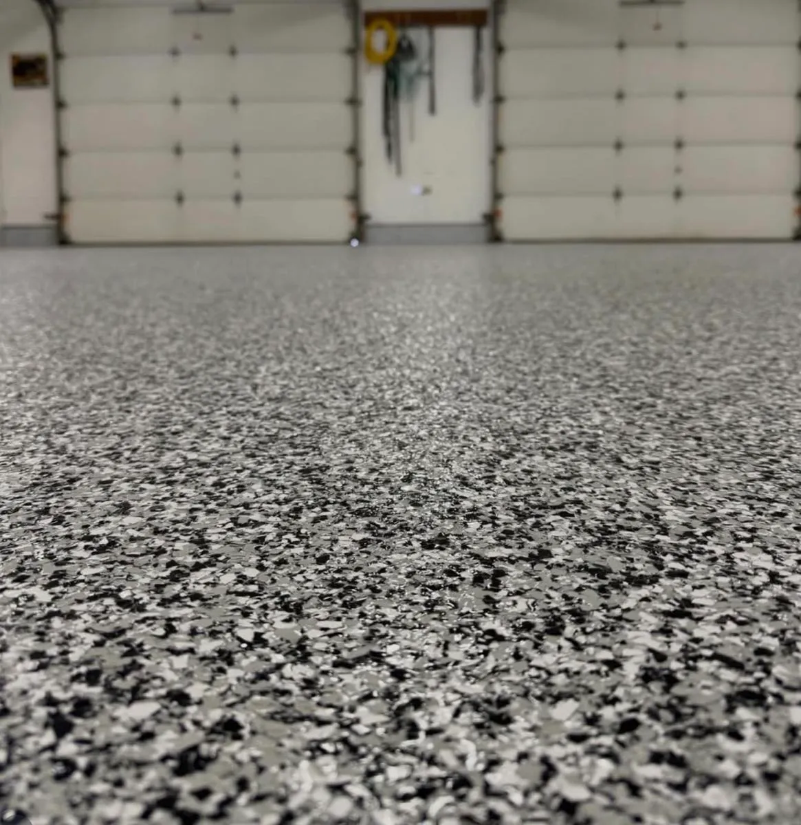 Black white and gray flake epoxy garage floor